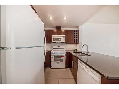 1405-55 Spruce Place Sw, Calgary, AB - Indoor Photo Showing Kitchen With Double Sink