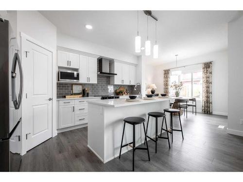 22 Belgian Court, Cochrane, AB - Indoor Photo Showing Kitchen With Upgraded Kitchen