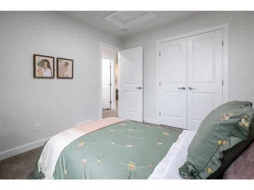 22 Belgian Court, Cochrane, AB - Indoor Photo Showing Bedroom