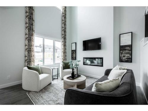 22 Belgian Court, Cochrane, AB - Indoor Photo Showing Living Room With Fireplace