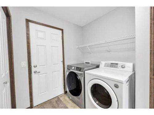 105 Aspenmere Place, Chestermere, AB - Indoor Photo Showing Laundry Room