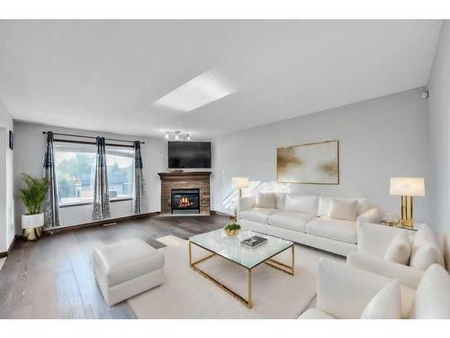 105 Aspenmere Place, Chestermere, AB - Indoor Photo Showing Living Room With Fireplace