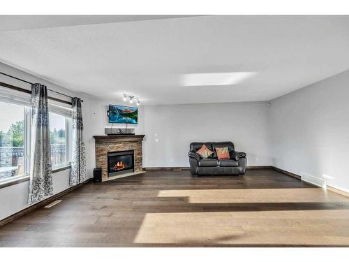 105 Aspenmere Place, Chestermere, AB - Indoor Photo Showing Living Room With Fireplace