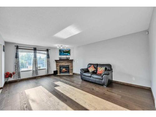 105 Aspenmere Place, Chestermere, AB - Indoor Photo Showing Living Room With Fireplace