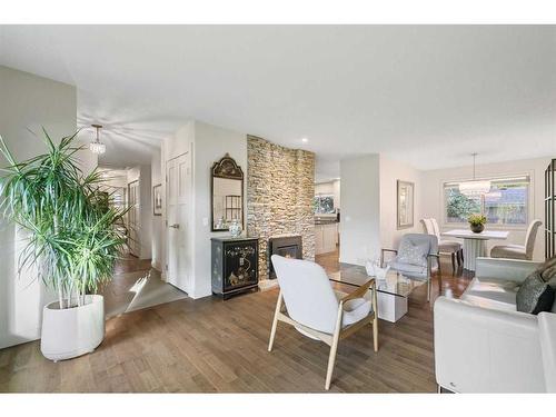 303 Woodpark Place, Calgary, AB - Indoor Photo Showing Living Room With Fireplace