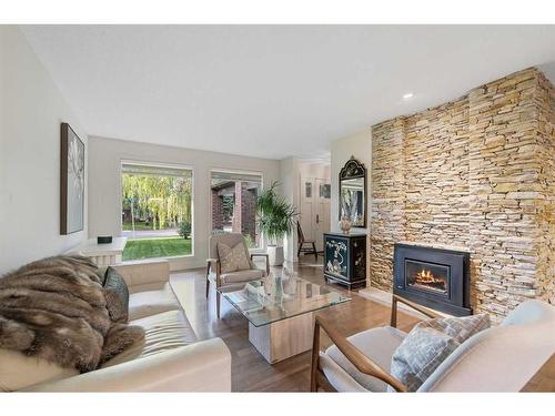 303 Woodpark Place, Calgary, AB - Indoor Photo Showing Living Room With Fireplace