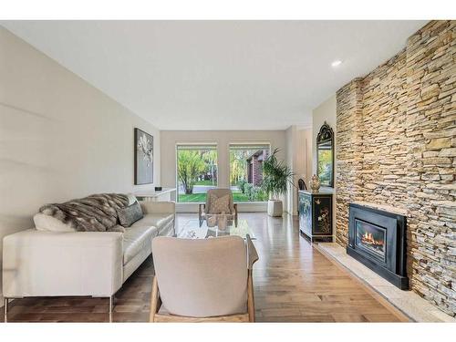 303 Woodpark Place, Calgary, AB - Indoor Photo Showing Living Room With Fireplace