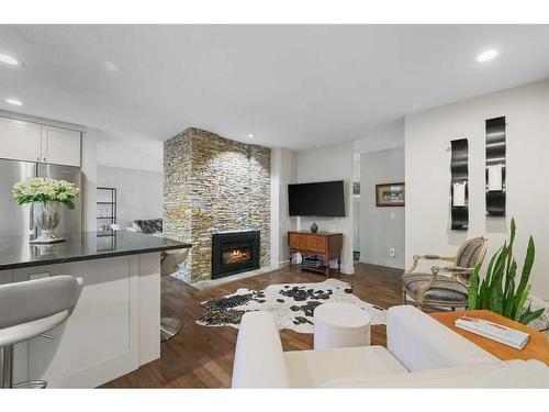 303 Woodpark Place, Calgary, AB - Indoor Photo Showing Living Room With Fireplace