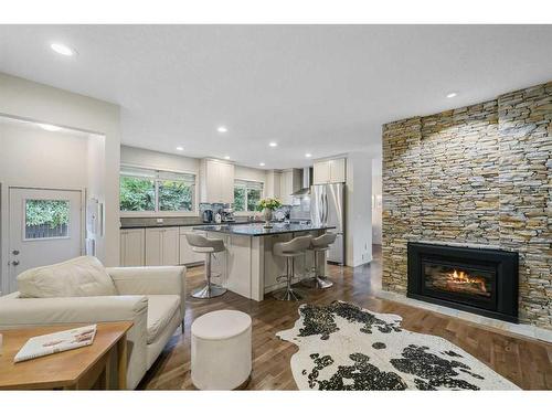 303 Woodpark Place, Calgary, AB - Indoor Photo Showing Living Room With Fireplace