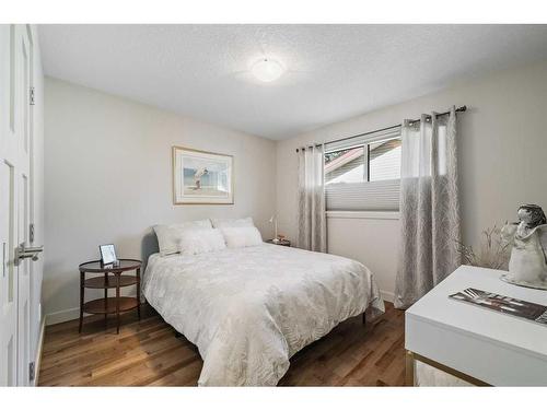 303 Woodpark Place, Calgary, AB - Indoor Photo Showing Bedroom