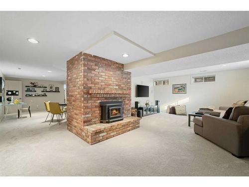 303 Woodpark Place, Calgary, AB - Indoor With Fireplace