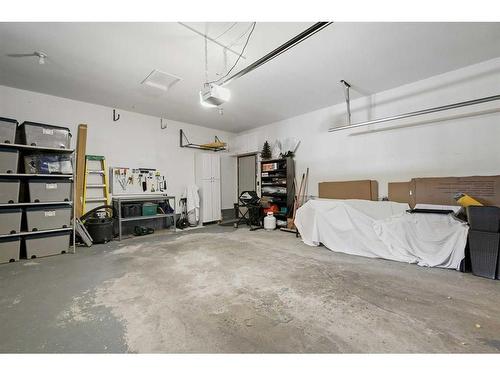 303 Woodpark Place, Calgary, AB - Indoor Photo Showing Garage