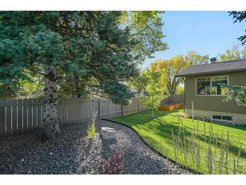 303 Woodpark Place, Calgary, AB - Outdoor With Backyard