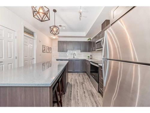 6217-151 Legacy Main Street Se, Calgary, AB - Indoor Photo Showing Kitchen With Stainless Steel Kitchen