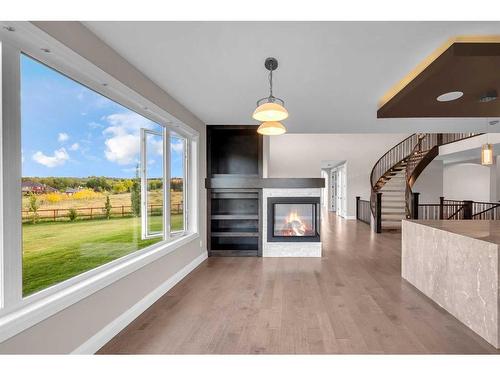 16053 243 Avenue East, Rural Foothills County, AB - Indoor Photo Showing Living Room With Fireplace