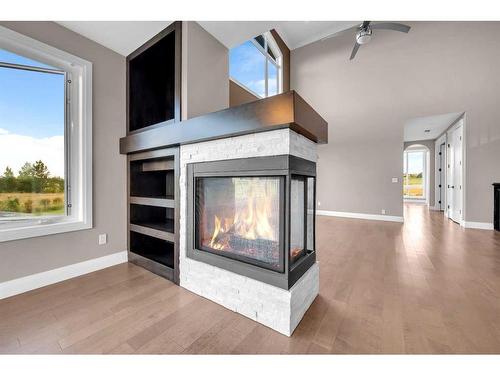 16053 243 Avenue East, Rural Foothills County, AB - Indoor Photo Showing Living Room With Fireplace