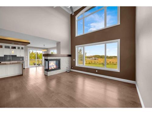 16053 243 Avenue East, Rural Foothills County, AB - Indoor Photo Showing Other Room With Fireplace