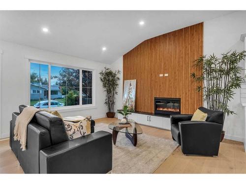 3244 Barr Road Nw, Calgary, AB - Indoor Photo Showing Living Room With Fireplace