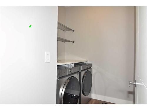 114 Carringford Close, Calgary, AB - Indoor Photo Showing Laundry Room