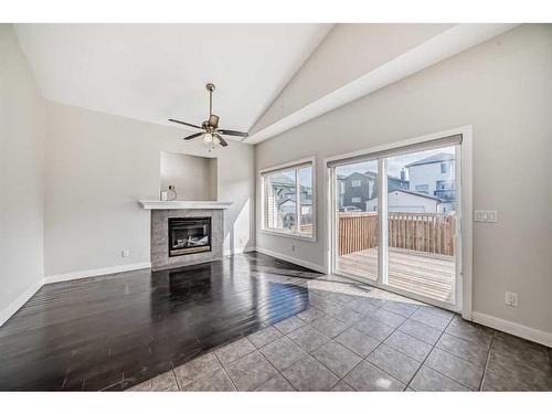 363 Taracove Estate Drive Ne, Calgary, AB - Indoor Photo Showing Living Room With Fireplace