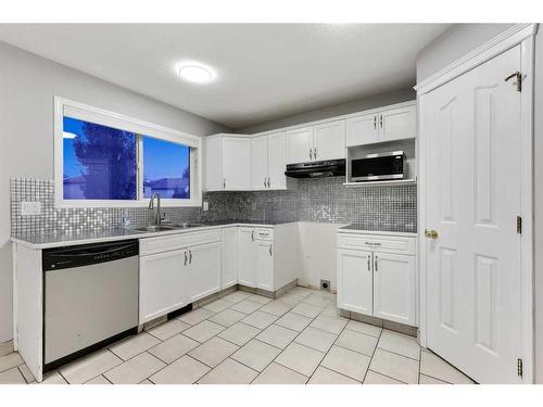 68 Bridlewood Crescent Sw, Calgary, AB - Indoor Photo Showing Kitchen With Double Sink