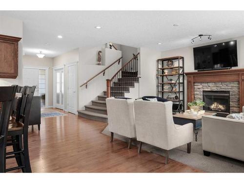 128 Elgin Estates Hill Se, Calgary, AB - Indoor Photo Showing Living Room With Fireplace