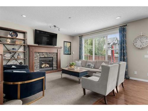 128 Elgin Estates Hill Se, Calgary, AB - Indoor Photo Showing Living Room With Fireplace