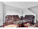 100 Martinvalley Crescent Ne, Calgary, AB  - Indoor Photo Showing Living Room 