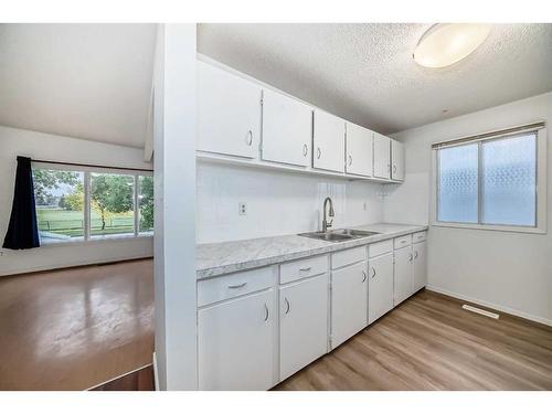 6303 Penbrooke Drive Se, Calgary, AB - Indoor Photo Showing Kitchen With Double Sink