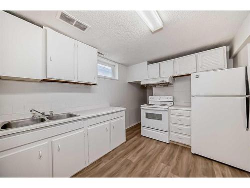 6303 Penbrooke Drive Se, Calgary, AB - Indoor Photo Showing Kitchen With Double Sink