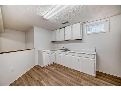 6303 Penbrooke Drive Se, Calgary, AB - Indoor Photo Showing Kitchen With Double Sink