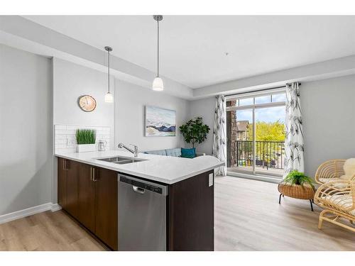 201-117 Copperpond Common Se, Calgary, AB - Indoor Photo Showing Kitchen With Double Sink