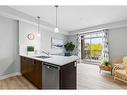 201-117 Copperpond Common Se, Calgary, AB  - Indoor Photo Showing Kitchen With Double Sink 