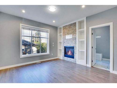 2034 38 Street Se, Calgary, AB - Indoor Photo Showing Living Room With Fireplace