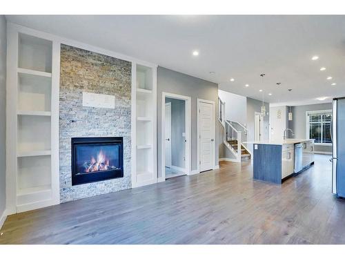 2034 38 Street Se, Calgary, AB - Indoor Photo Showing Living Room With Fireplace