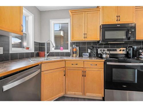 303 Sagewood Landing Sw, Airdrie, AB - Indoor Photo Showing Kitchen With Double Sink