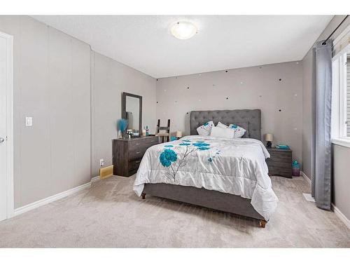 303 Sagewood Landing Sw, Airdrie, AB - Indoor Photo Showing Bedroom