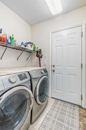 104 Panamount Manor Nw, Calgary, AB - Indoor Photo Showing Laundry Room