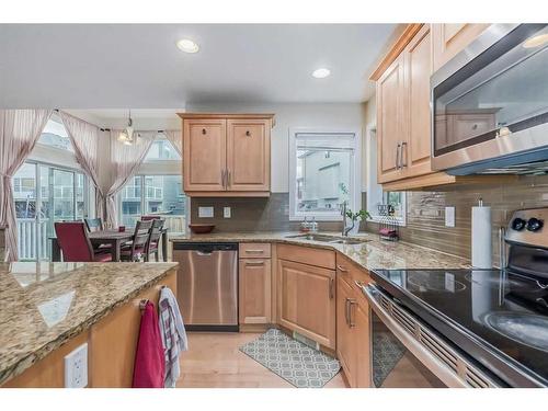 104 Panamount Manor Nw, Calgary, AB - Indoor Photo Showing Kitchen With Double Sink