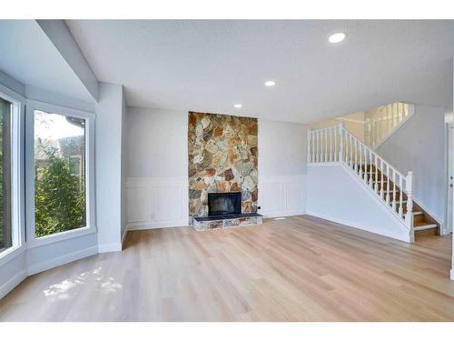 59 Whitehaven Road Ne, Calgary, AB - Indoor Photo Showing Living Room With Fireplace