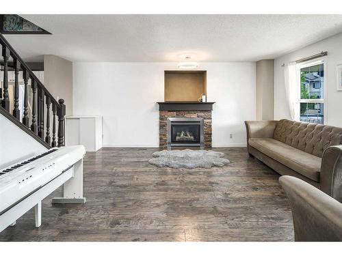 362 Copperfield Grove Se, Calgary, AB - Indoor Photo Showing Living Room With Fireplace