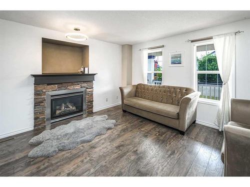 362 Copperfield Grove Se, Calgary, AB - Indoor Photo Showing Living Room With Fireplace