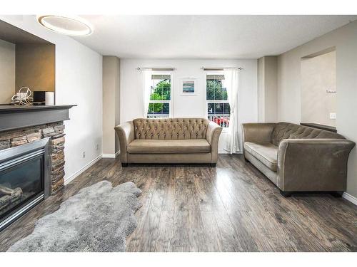 362 Copperfield Grove Se, Calgary, AB - Indoor Photo Showing Living Room With Fireplace