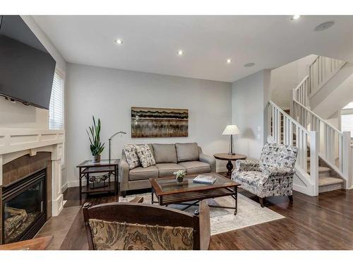 25 Cranleigh Heath Se, Calgary, AB - Indoor Photo Showing Living Room With Fireplace