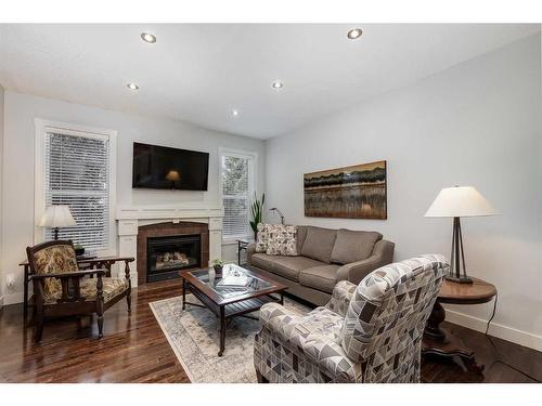 25 Cranleigh Heath Se, Calgary, AB - Indoor Photo Showing Living Room With Fireplace