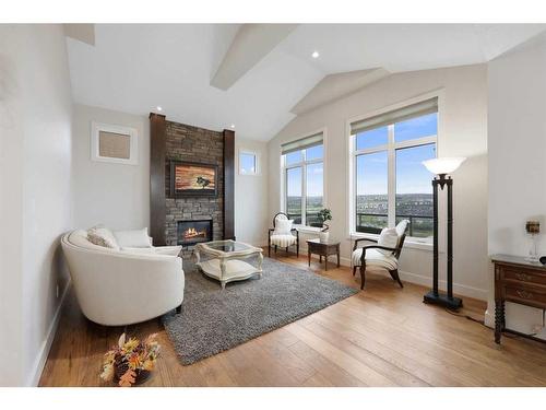 59 Evansridge View Nw, Calgary, AB - Indoor Photo Showing Other Room With Fireplace