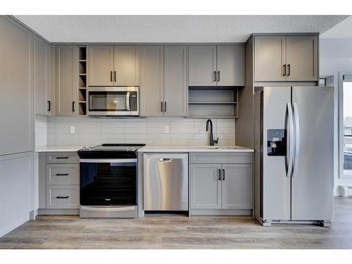 2401-350 Livingston Common Ne, Calgary, AB - Indoor Photo Showing Kitchen With Stainless Steel Kitchen With Upgraded Kitchen