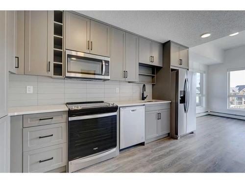 2401-350 Livingston Common Ne, Calgary, AB - Indoor Photo Showing Kitchen With Upgraded Kitchen