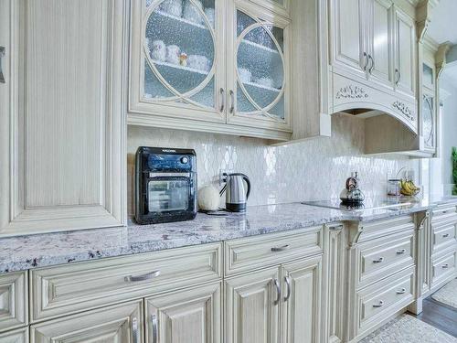 106 Trinity Road, Rural Rocky View County, AB - Indoor Photo Showing Kitchen With Upgraded Kitchen