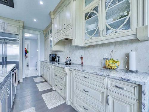 106 Trinity Road, Rural Rocky View County, AB - Indoor Photo Showing Kitchen With Upgraded Kitchen